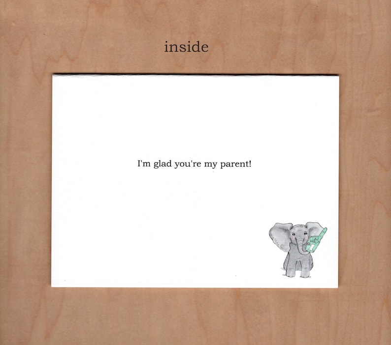 Inside of card reads "I'm glad you're my parent!"  there is an additional little illustration in the bottom right corner of a little elephant holding a blue foam finger with the number one on it