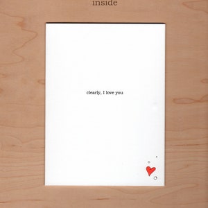 Inside of card:  message reads "clearly, I love you".  A little illustration of a heart and bubbles in the bottom right corner