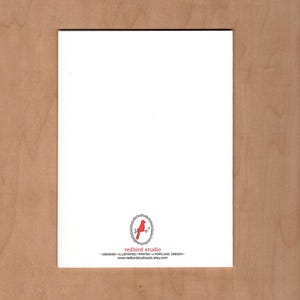 May include: A rectangular white card with a small red bird logo inside an oval frame at the bottom center. Below the logo, the text reads redbird studio, DESIGNED ILLUSTRATED PRINTED in PORTLAND, OREGON, and www.redbirdstudiopdx.etsy.com.