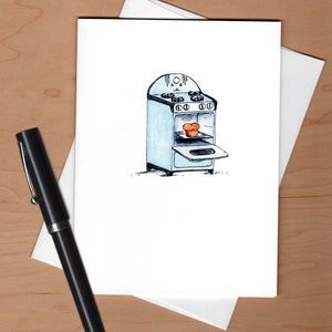 May include: A watercolor illustration of a vintage blue stove with an open oven door. A loaf of bread is inside the oven.
