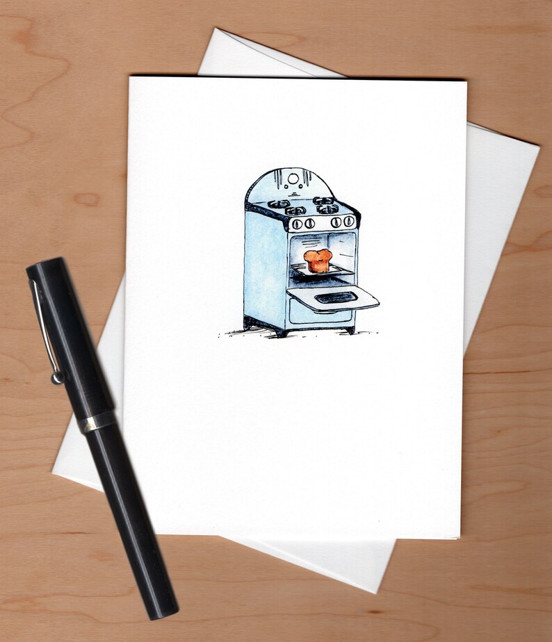 May include: A watercolor illustration of a vintage blue stove with an open oven door. A loaf of bread is inside the oven.