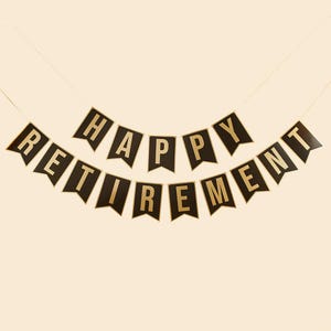 May include: Black and gold banner with the text "Happy Retirement" in gold letters.