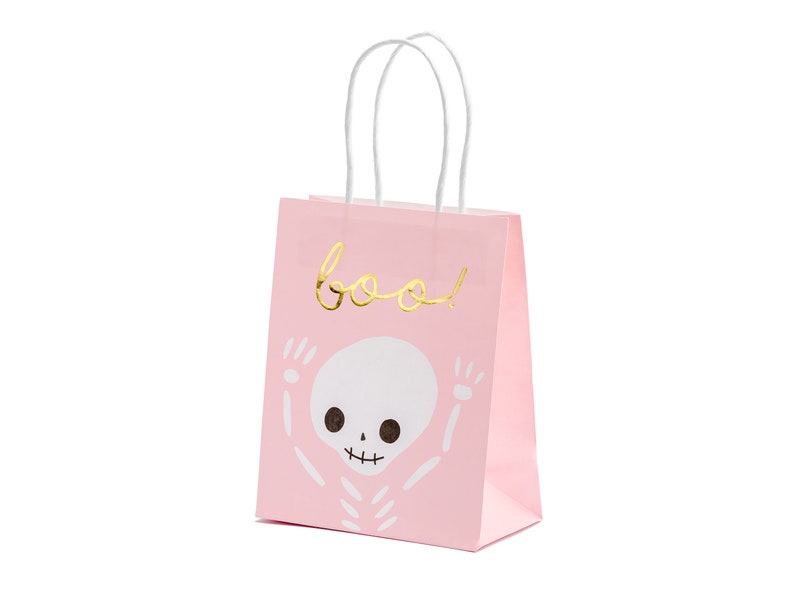 May include: Pink paper gift bag with white handles. The bag has a gold foil skeleton design and the word "boo!" in gold foil lettering.