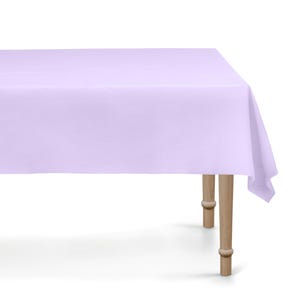 May include: A rectangular lavender tablecloth draped over a wooden table. The tablecloth is a solid color and covers the entire table surface. The table has four wooden legs.