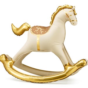 May include: A cream-coloured rocking horse balloon with gold accents. The balloon features a gold mane, tail, and rocker base. The saddle is brown with a gold letter "R". A decorative party item.