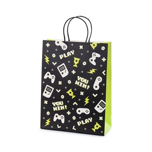 May include: Black and green paper gift bag with a repeating pattern of video game controllers, game consoles, and the text "PLAY" and "YOU WIN!"