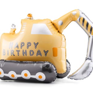 以下が含まれることがあります： 「HAPPY BIRTHDAY」の文字が入った、黄色のショベルカー型の風船。 黒と黄色のストライプが入った銀色の腕と、白とオレンジのアクセントが付いた灰色のベースが特徴です。 お祝いの誕生日の装飾。