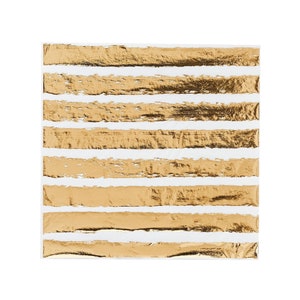 May include: Square white paper napkin with horizontal gold foil stripes. The gold stripes have a textured, distressed appearance, creating a decorative and elegant design. Ideal for parties, events, or everyday use.