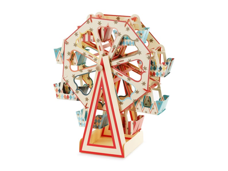 May include: A colorful papercraft Ferris wheel with red, white, blue, and gold accents. The wheel has eight gondolas, each with a different pattern. The Ferris wheel is made of paper and is designed to be assembled.