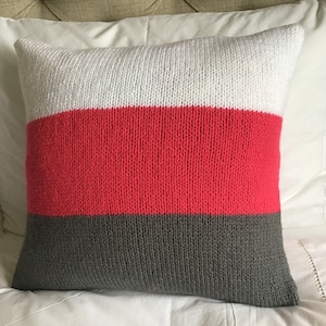 Hand knitted pomegranate/white/graphite Aran wool colour block cushion cover