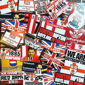 May include: A collection of colourful stickers featuring the Southampton Football Club logo, the team's name, and various slogans. The stickers are in a variety of sizes and shapes, and some feature the team's colours of red and white. The stickers are arranged in a random pattern, and some are overlapping. The text on the stickers includes "Southampton", "Boys Are In Town", "The Pride of the South", "SFC Loyal", "1885 Hampshire", and "We Are Southampton".