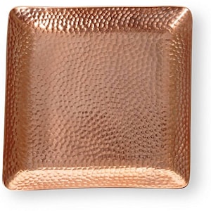May include: A square copper tray with a hammered finish. The tray has a slightly raised edge and is perfect for serving snacks or drinks.