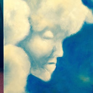 May include: Abstract painting of a face with a white and blue color scheme. The face is painted in a soft, dreamy style, with a focus on the eyes and mouth.