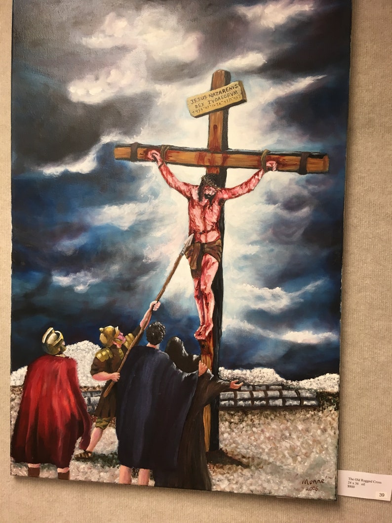 May include: A painting depicting a scene from the crucifixion of Jesus Christ. The painting shows Jesus on the cross with a sign above his head that reads "JESUS NAZARENUS REX IUDAEORUM". There are three figures in the foreground, two of them appear to be Roman soldiers, and one is a man in a dark robe. The sky is dark and stormy.