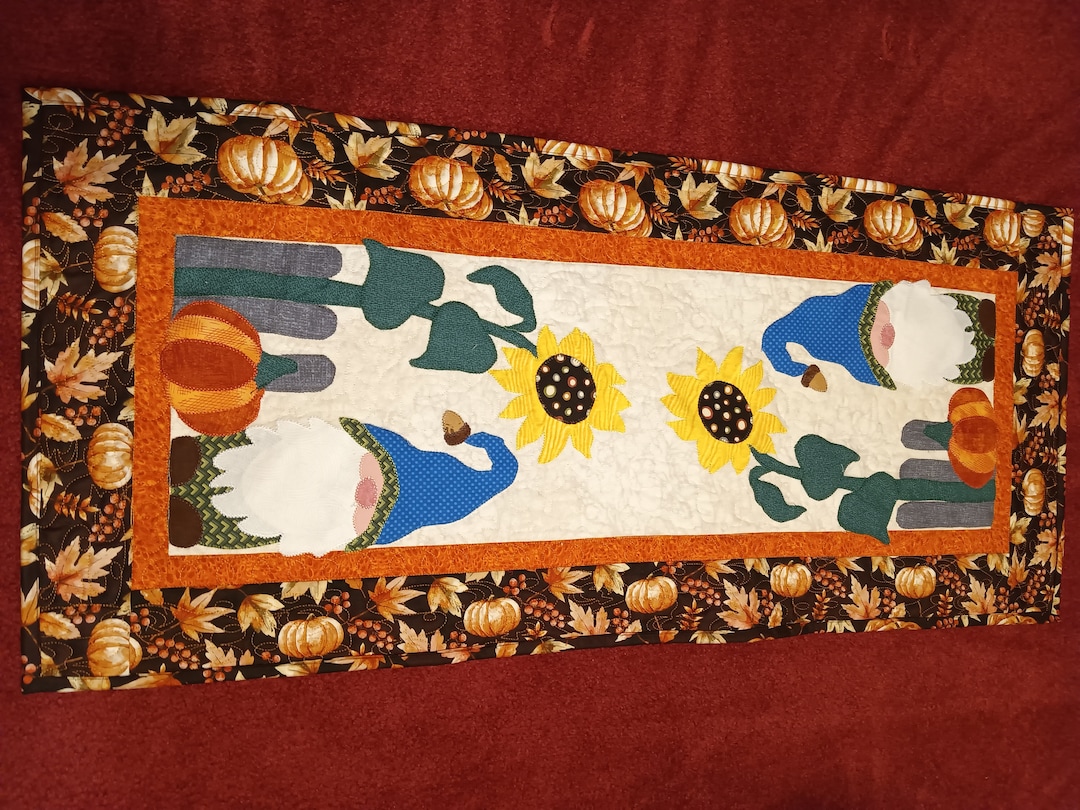 Cozy Gnome Quilted Table Topper NCU0NTV569