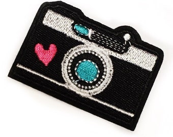 Toppa termoadesiva con macchina fotografica: applicazione artistica con fotografia