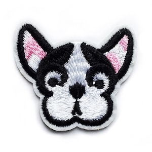 May include: Embroidered iron-on patch of a black and white French bulldog with pink ears.