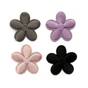 May include: Four embroidered flower patches in different colors: gray, purple, pink, and black.