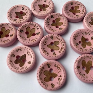 15mm buttons in natural and pastel finishes for authentic craft projects. pink dyed buttons for knitting. 15mm in diameter.