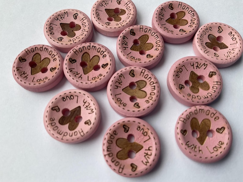 15mm buttons in natural and pastel finishes for authentic craft projects. pink dyed buttons for knitting. 15mm in diameter.