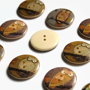 Cute owl design buttons which are printed on the front and have a plain back.