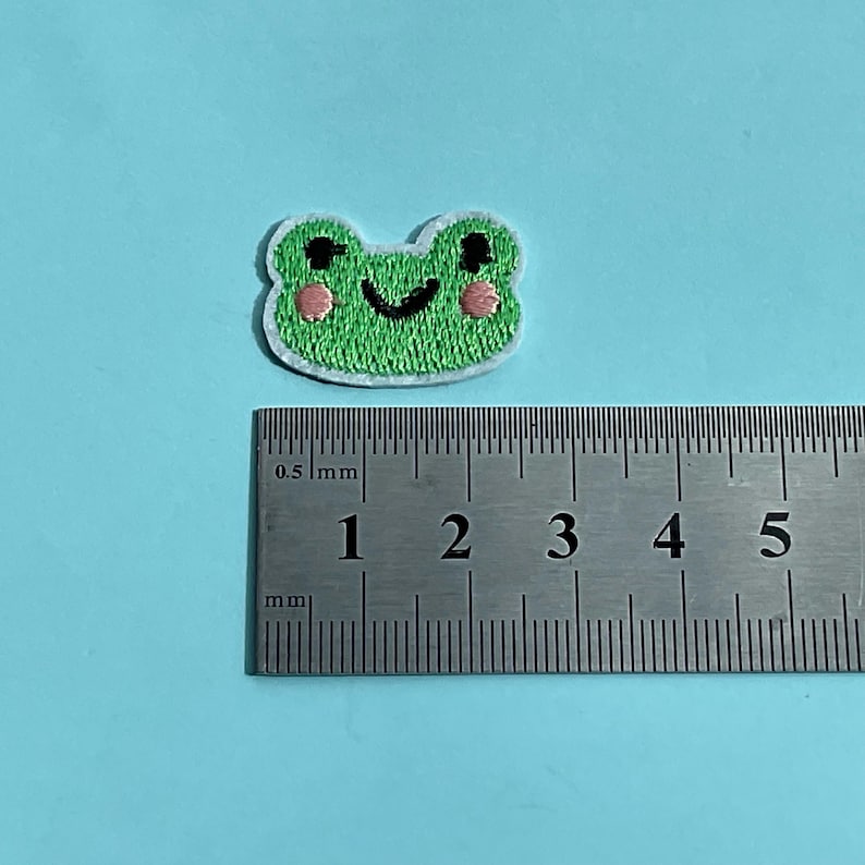 Micro patch in shap of green frog