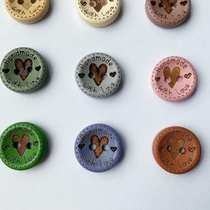 Dusky pink and sage green wood buttons with 2 holes for crochet crafts.