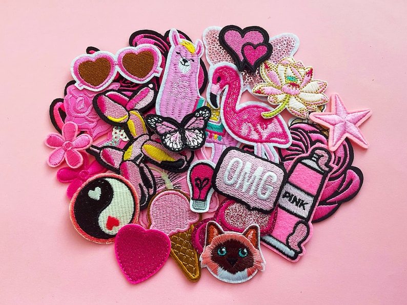 Pink patch bundle of patches.  Patches chosen at random from Button Cool's range. Possible patches are balloon dog, flamingo,...