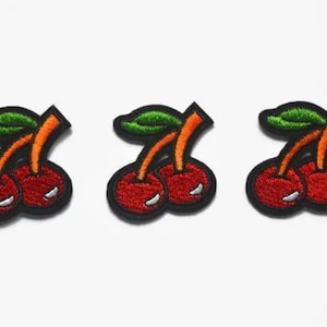 May include: Three embroidered iron-on patches of red cherries with green leaves and orange stems.