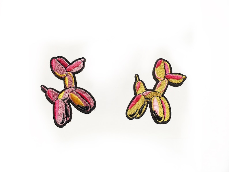 Pink and yellow balloon dog badge