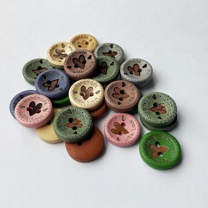 Creamy white and blue grey sewing buttons with 'Hand Made with Love' text.