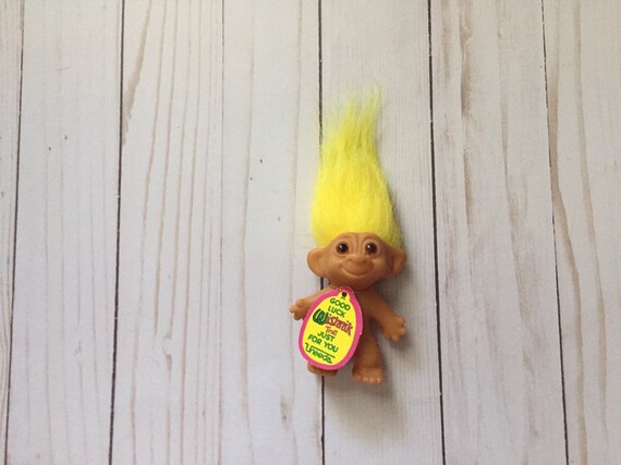 troll doll with horseshoes on feet