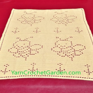 May include: A crocheted baby blanket with a beige background and a pattern of bees and anchors. The blanket has a scalloped edge and the text "YarnCrochetGarden.com" is visible in the bottom right corner.