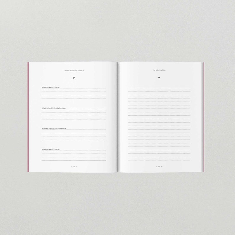 May include: An open book with lined pages. The left page has the title "Unsere W&uuml;nsche f&uuml;r Dich" and the right page has the title "Ein Brief an Dich".