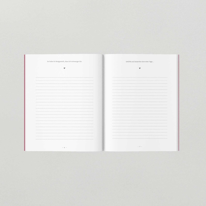 May include: An open notebook with lined pages. The left page has the text "So habe ich festgestellt, dass ich schwanger bin." The right page has the text "Gef&uuml;hle und Gedanken der ersten Tage."