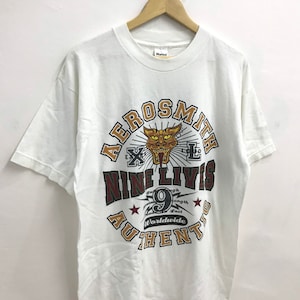 送料無料！ヴィンテージ 1997 エアロスミス ナイン ライヴス オーセンティック Tシャツ。サイズ L。アメリカ製