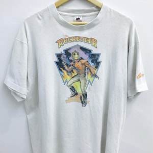 Livraison gratuite! vintage des années 90 The Rocketeer tshirt..Fictional Superhero Comic..Action movie..by Dave Stevens..Graphitti..Size XL..Made in USA.