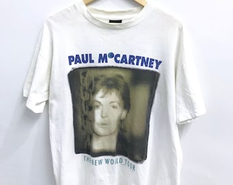 Vintage 90s Paul Mc Cartney "The New World Tour" camiseta.. Los Beatles. John Lennon. Tamaño L. Hecho en EE.UU.