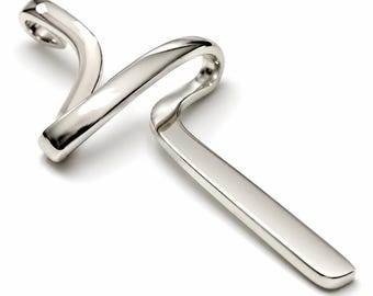 May include: A polished silver-toned metal pendant featuring a continuous, fluid, and abstract ribbon-like design. The piece has a smooth, reflective surface with a single loop at the top for suspension, characterised by its elongated, curved, and sculptural form.