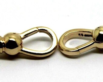 May include: Two gold-toned metal watch chain connectors. Each connector has a round loop on one end and a round ball on the other end.