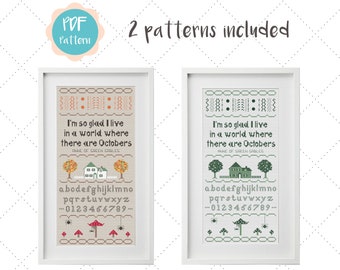 May include: Two cross-stitch patterns featuring the quote "I'm so glad I live in a world where there are Octobers." The patterns are in different color schemes, one with a brown and orange color scheme and the other with a green color scheme. Both patterns include the text "Anne of Green Gables".