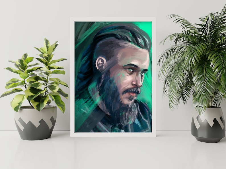 May include: A framed portrait of a man with a beard and long hair, painted in shades of green, blue, and gray. The artwork is displayed on a white surface, flanked by potted plants. The man's eyes are a striking green.