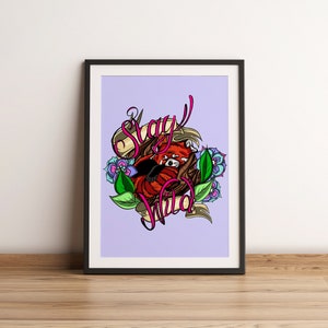 May include: A framed print with a purple background featuring a red panda curled up in a nest of leaves and flowers. The text "Stay Wild" is written in pink and white lettering.