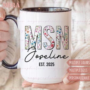 May include: White ceramic mug with a black rim and handle. The mug features the letters "MSN" filled with a floral pattern, the name "Joseline", and the text "EST. 2025". The mug is held by a person.