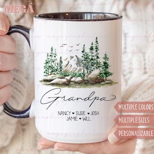 Peut inclure: Une tasse en céramique blanche avec un bord et une poignée noirs. La tasse présente une illustration aquarelle d'une chaîne de montagnes avec des pins et des rochers. Le texte "Grandpa" est écrit en cursive noire avec un symbole de cœur. Sous le texte figurent les noms "Nancy, Susie, Josh, Jamie, Will" avec des symboles de cœur entre chaque nom. Le texte "Couleurs multiples, Tailles multiples, Personnalisable" est imprimé en noir au bas de la tasse.