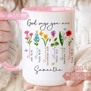 May include: White 15oz ceramic mug with a pink interior and handle. The mug features the text "God says you are" and floral illustrations with words like "Chosen" and "Unique". The name "Samantha" is also printed on the mug.
