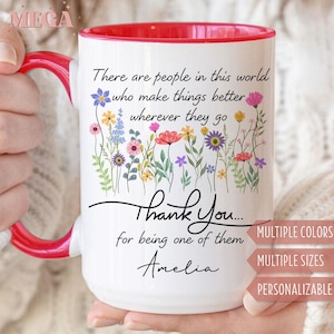 May include: White ceramic mug with a red interior and handle. The mug features a floral design with the text "There are people in this world who make things better wherever they go. Thank You... for being one of them Amelia."