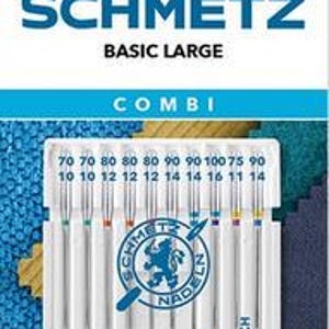 Könnte beinhalten: Eine Packung Schmetz Basic Large Combi Nähmaschinennadeln. Die Packung enthält 10 Nadeln in den Größen 70, 80, 90, 100 und 75. Die Nadeln sind als Universal-, Jeans- und Stretchnadeln gekennzeichnet.