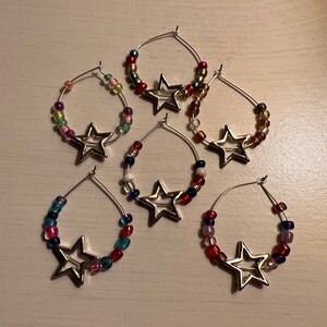 Seasons beads with star charms, wine glass charms. Set of 6.