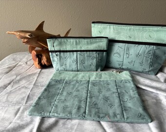 Teal shark tooth zipper bags